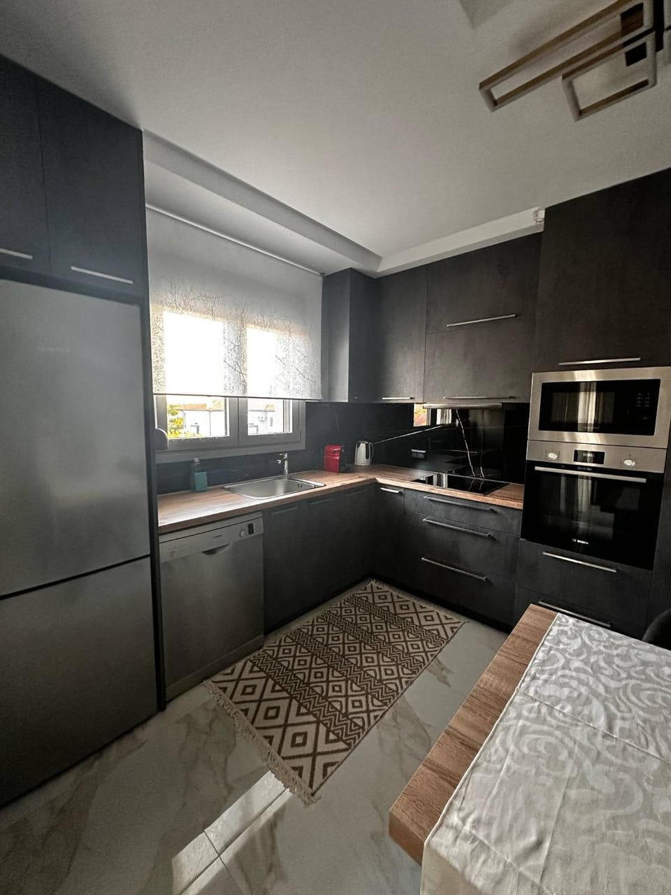 Kitchen or kitchenette, dishwasher, microwave, oven, stove, kitchen