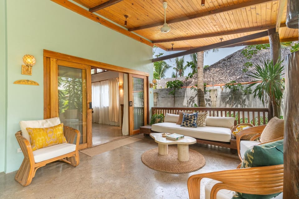 Property building, Patio, Living room, Seating area, Garden view, Pool view