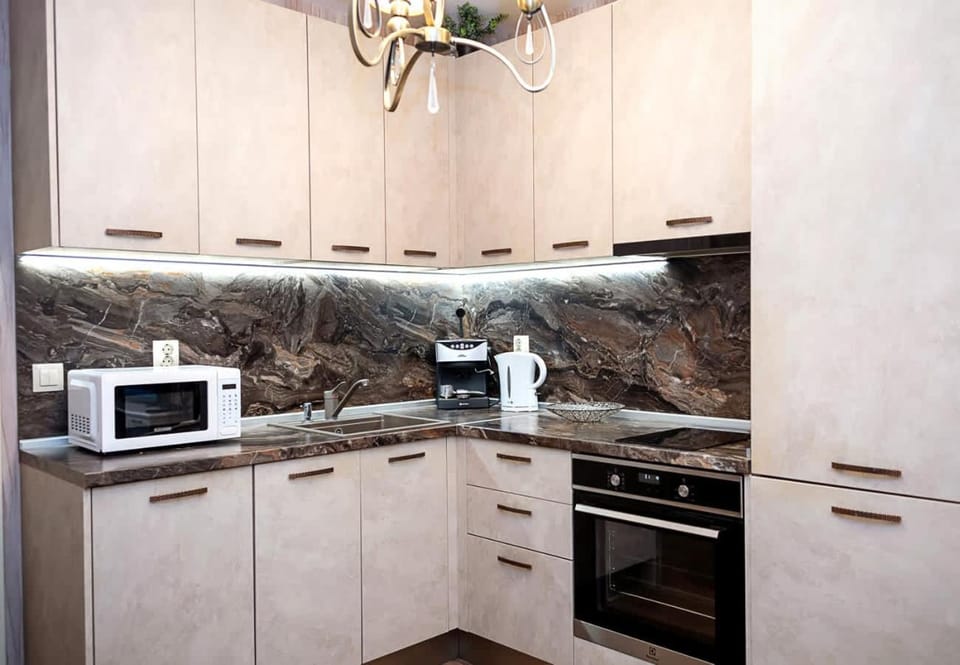 Kitchen or kitchenette, dishwasher, oven, stove