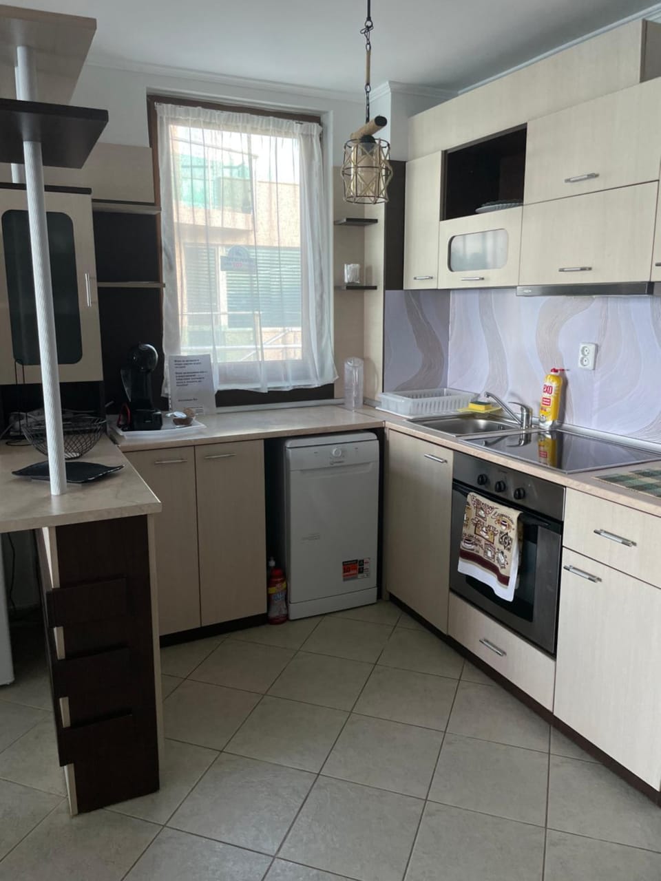 Kitchen or kitchenette, dishwasher, oven, stove