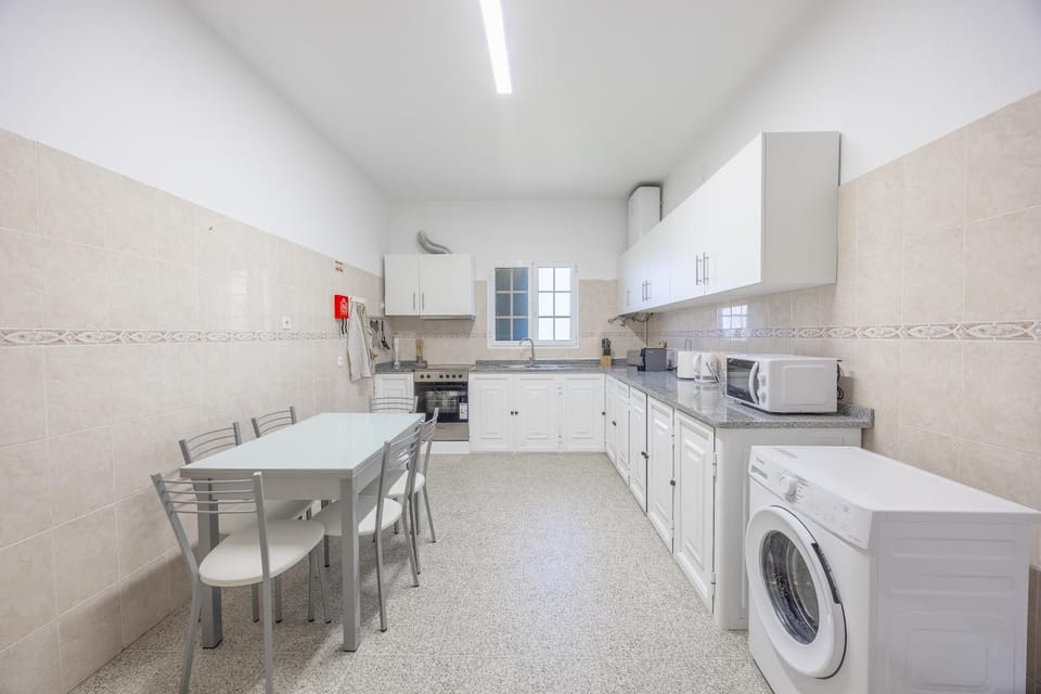 Kitchen or kitchenette, Dining area, stove, washing machine