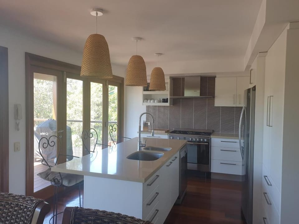 Kitchen or kitchenette, dishwasher, oven, stove