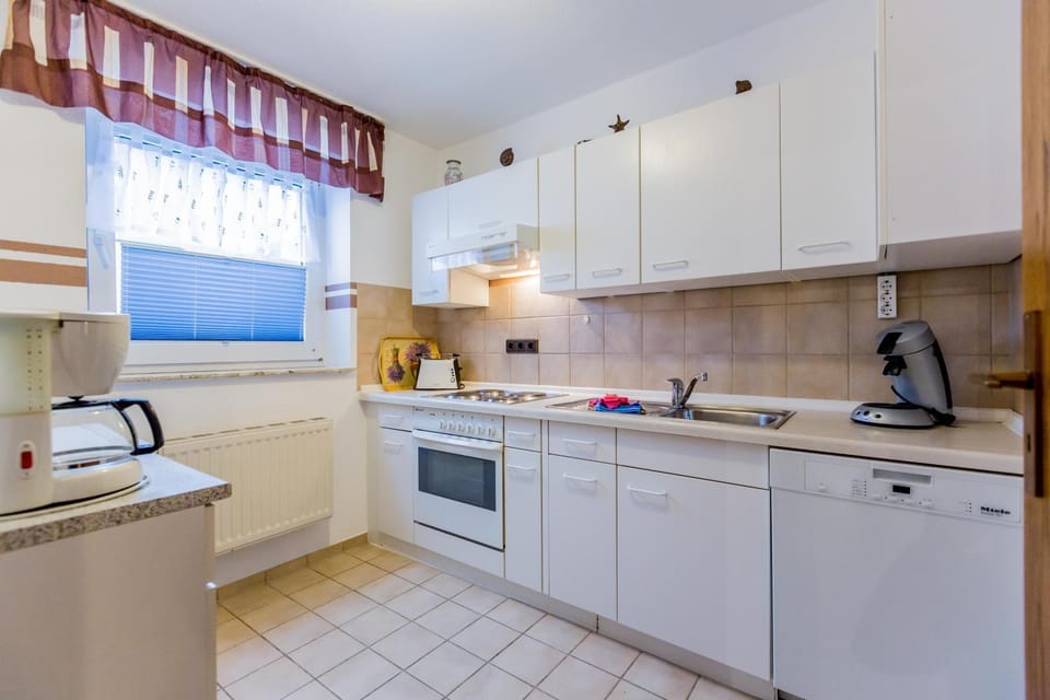 Kitchen or kitchenette, dishwasher, stove, toaster