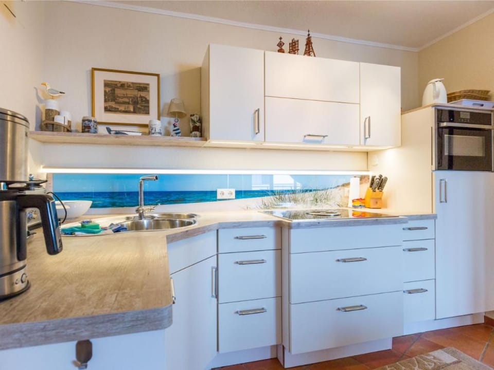 Kitchen or kitchenette, dishwasher, stove, toaster