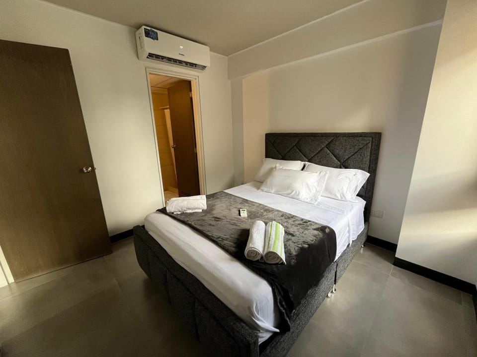 Bed, Photo of the whole room, towels, wardrobe, air conditioner