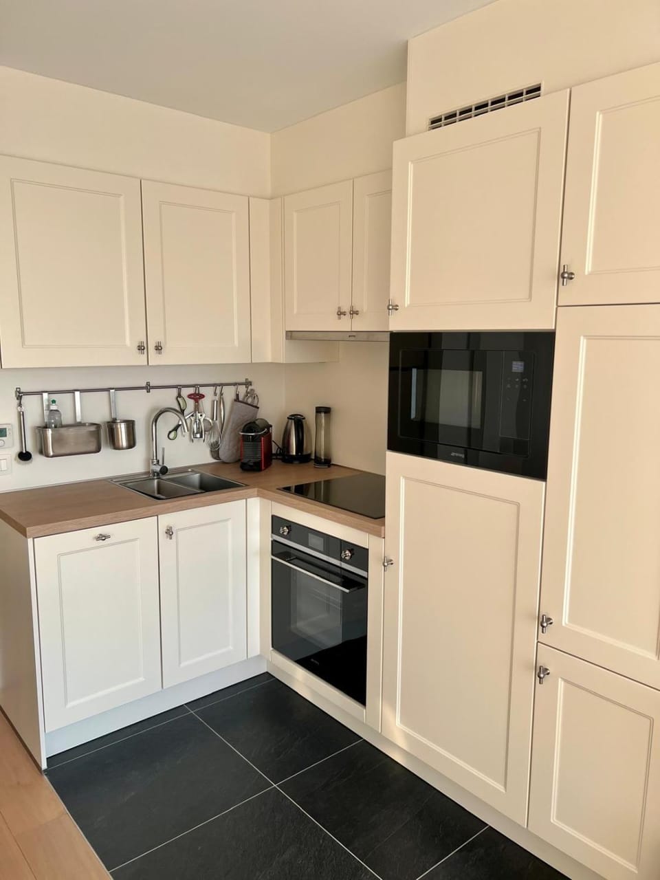 Kitchen or kitchenette, dishwasher, oven, stove