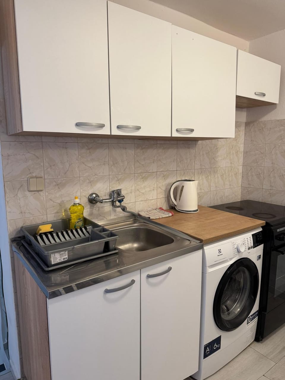 Kitchen or kitchenette, washing machine