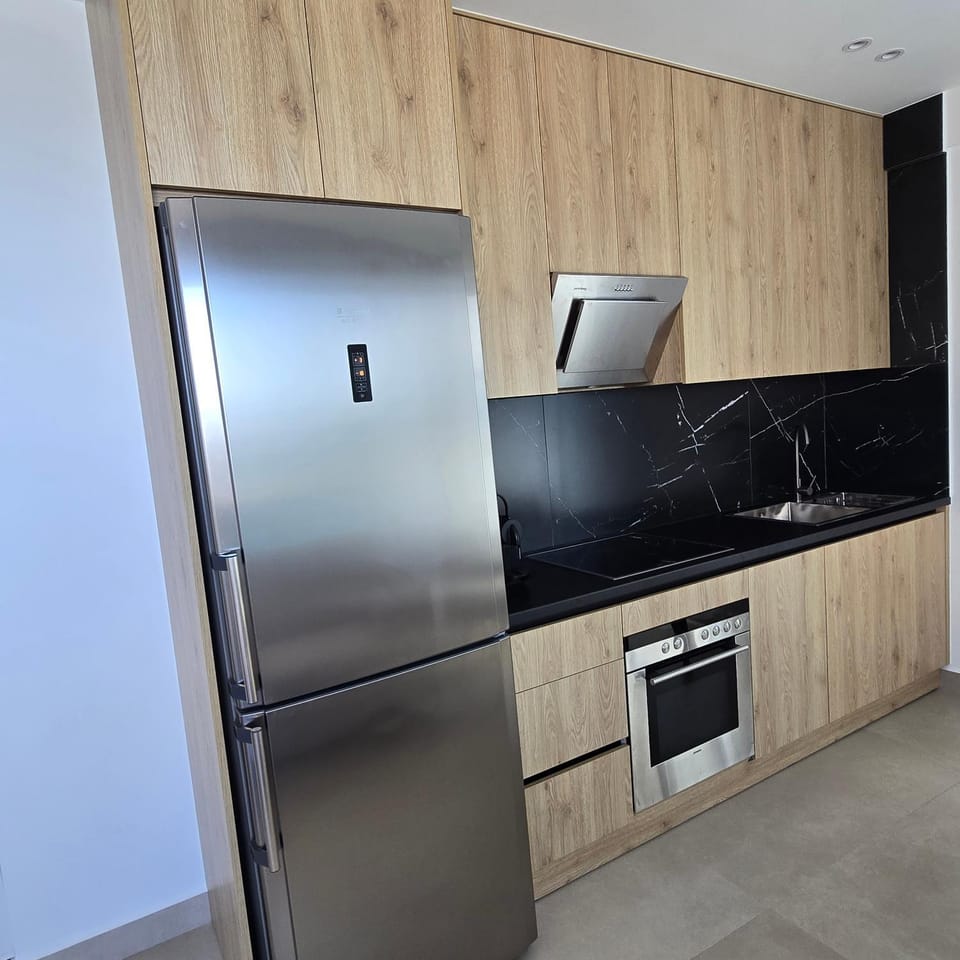Kitchen or kitchenette, dishwasher, oven, stove