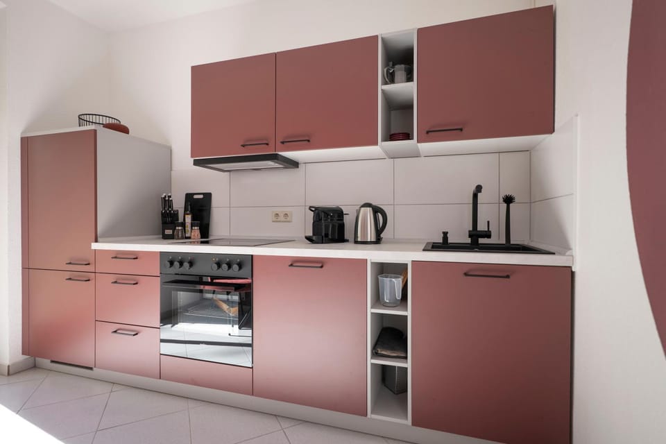 Kitchen or kitchenette, dishwasher, oven, stove, toaster