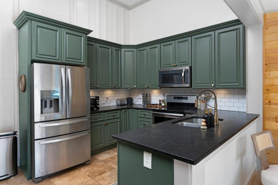 Kitchen or kitchenette, dishwasher, oven, stove, toaster