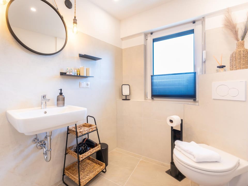Toilet, Bathroom, hair dryier, towels