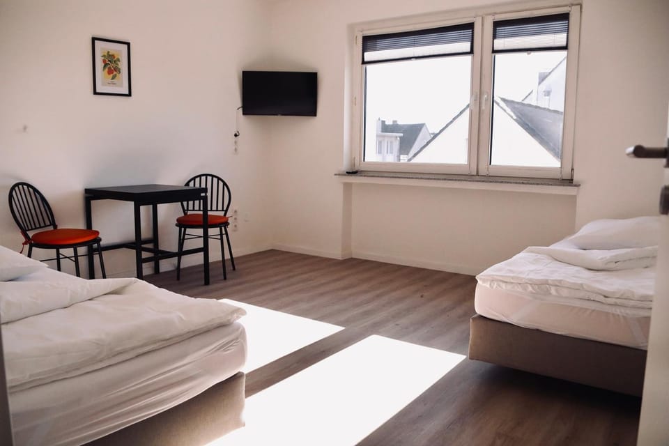 Bed, TV and multimedia, Living room, Seating area, Bedroom