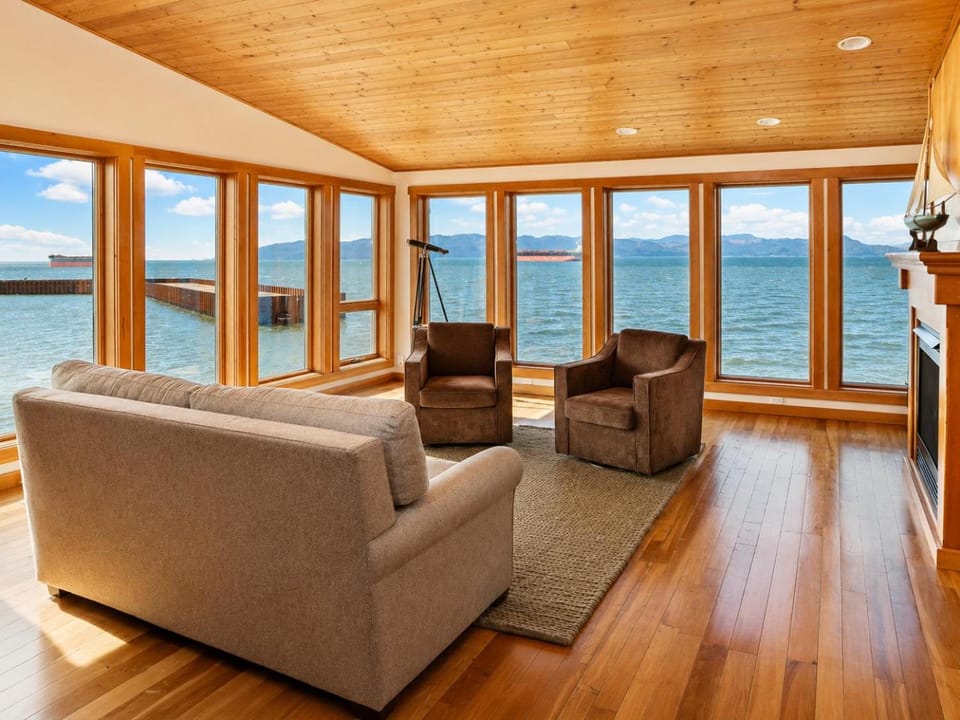 Bed, View (from property/room), Living room, Seating area, Mountain view, Mountain view, River view, River view, Sunrise, Sunset, fireplace, furniture, minibar, soundproof