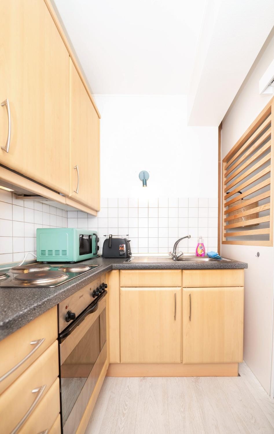 Kitchen or kitchenette, stove, toaster