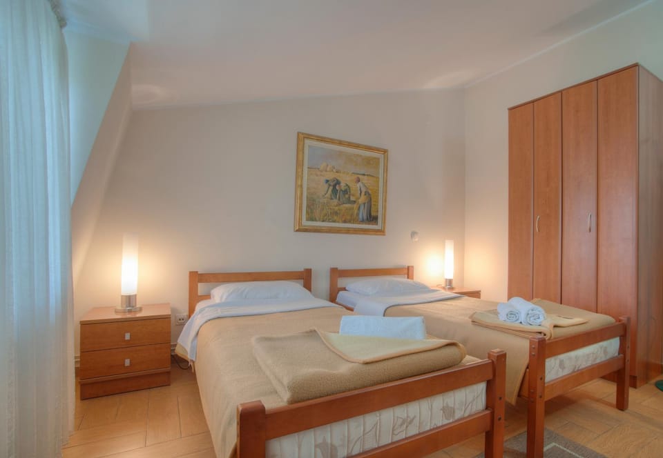 Bed, towels, wardrobe