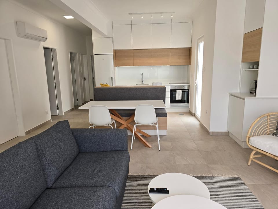 Kitchen or kitchenette, Living room, Seating area, Dining area, dishwasher, flat iron, microwave, oven, stove, washing machine, dryer