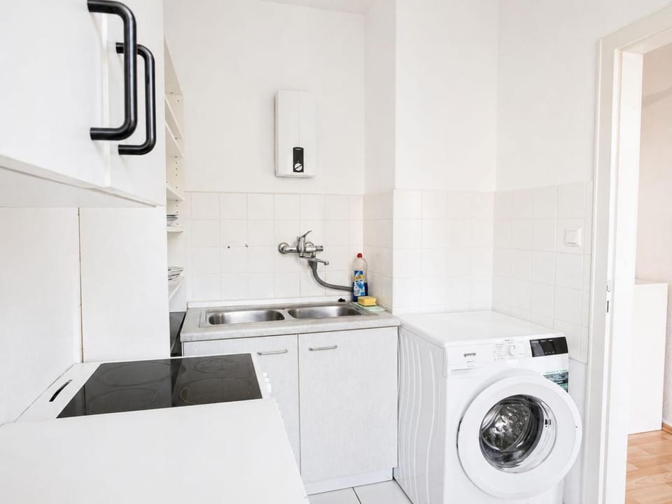 Kitchen or kitchenette, washing machine