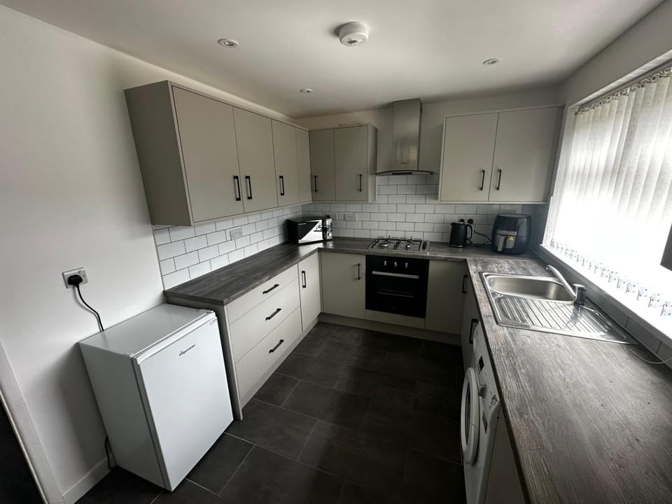 Kitchen or kitchenette, internet, oven, stove, toaster