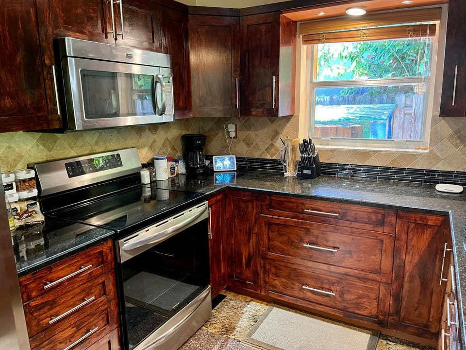 Kitchen or kitchenette, dishwasher, oven, stove, toaster