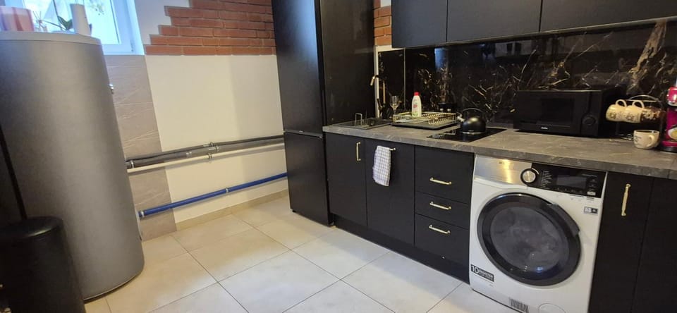 Kitchen or kitchenette, dishwasher, oven, stove, washing machine, dryer