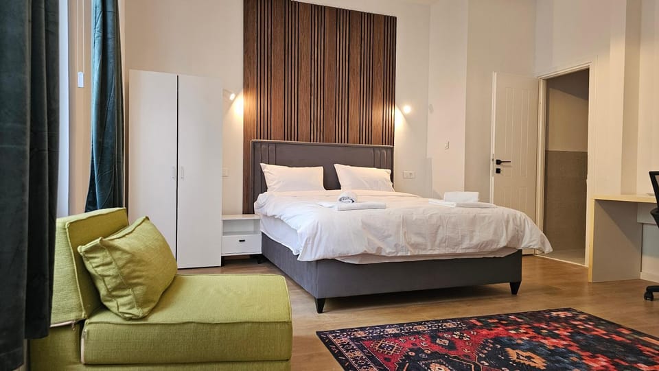Bed, Seating area, wardrobe