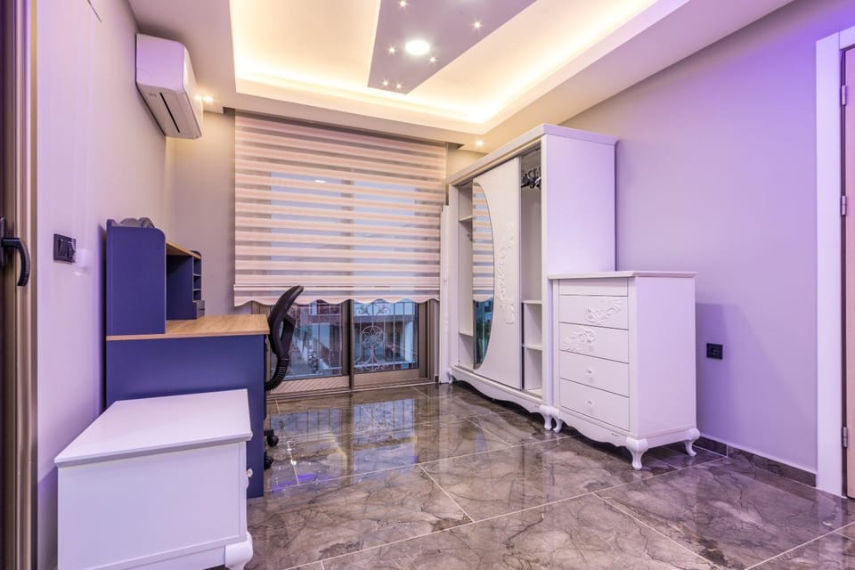 TV and multimedia, Kitchen or kitchenette, Living room, Seating area, oven, wardrobe, air conditioner