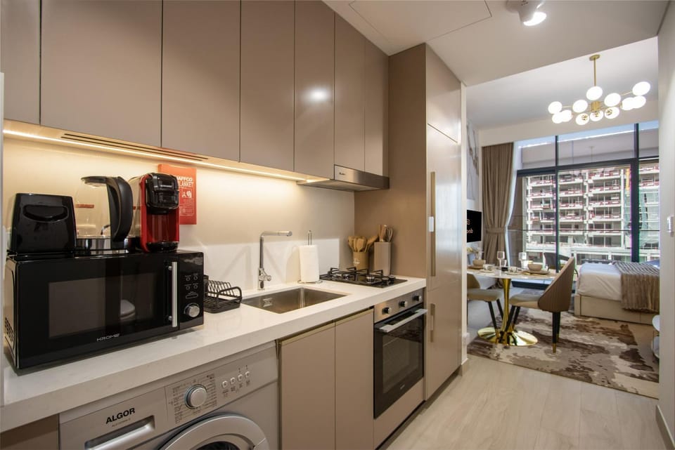 Kitchen or kitchenette, oven, stove, toaster, washing machine