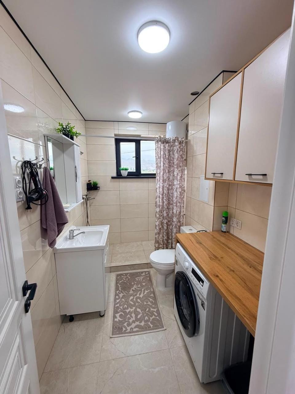 Toilet, Bathroom, towels, washing machine, dryer