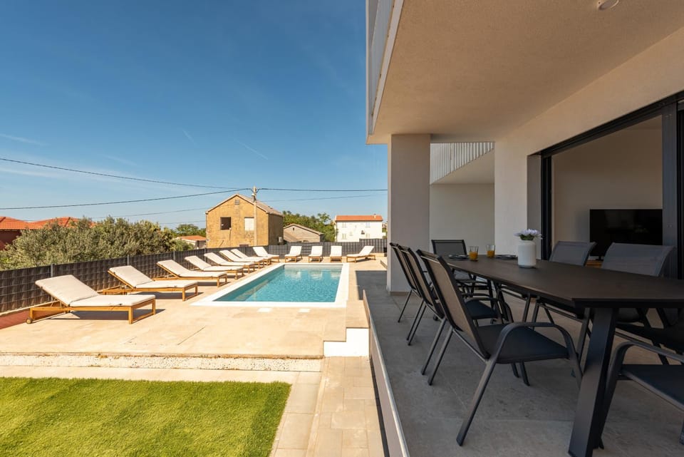 Property building, Patio, View (from property/room), Balcony/Terrace, Pool view, sunbed