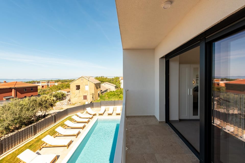 Property building, Patio, View (from property/room), Balcony/Terrace, Pool view, Swimming pool, sunbed