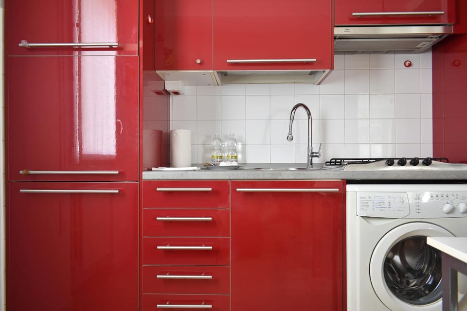 Kitchen or kitchenette, stove, washing machine
