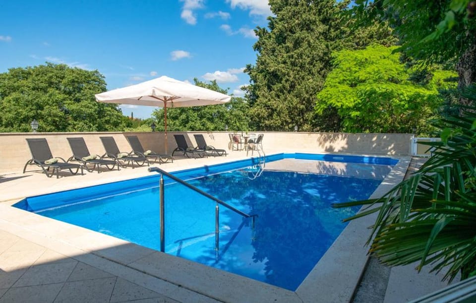 Patio, Day, Pool view, Swimming pool, sunbed