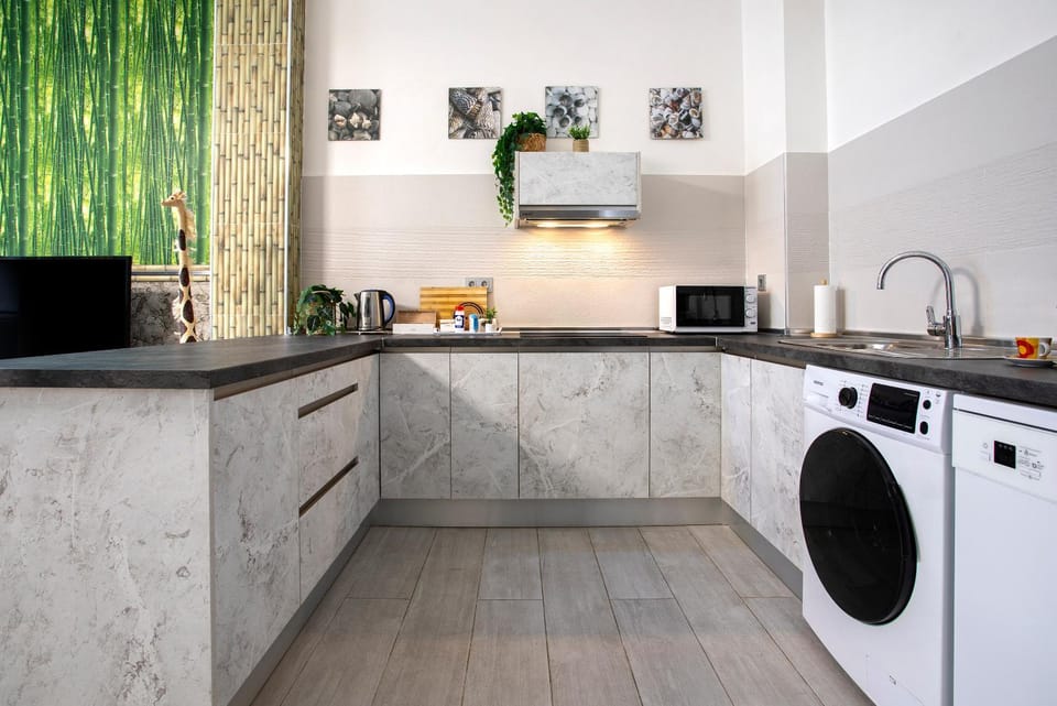 Kitchen or kitchenette, dishwasher, stove, washing machine