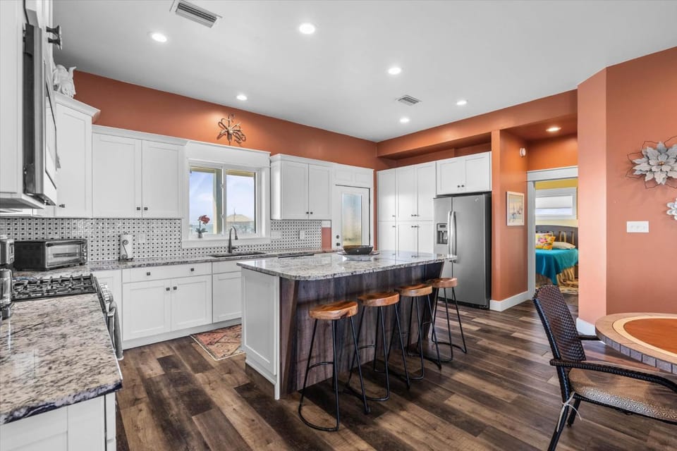 Kitchen or kitchenette, furniture, microwave, oven, stove, toaster, kitchen, air conditioner