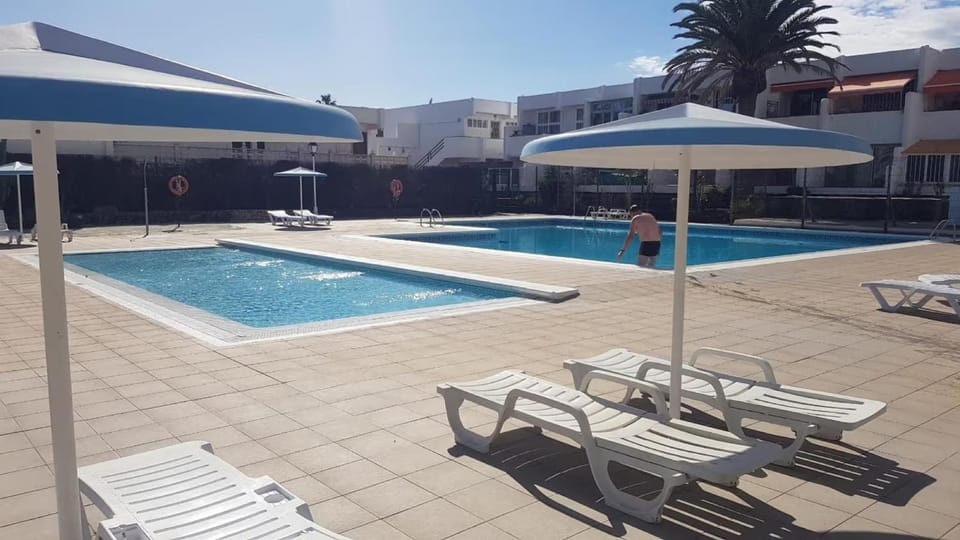 Property building, Living room, Swimming pool