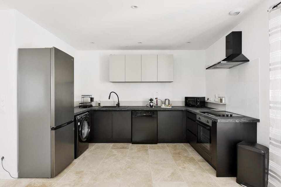 Kitchen or kitchenette, dishwasher, oven, stove, toaster, washing machine, dryer, kitchen