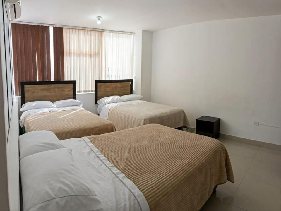 Bed, towels, wardrobe