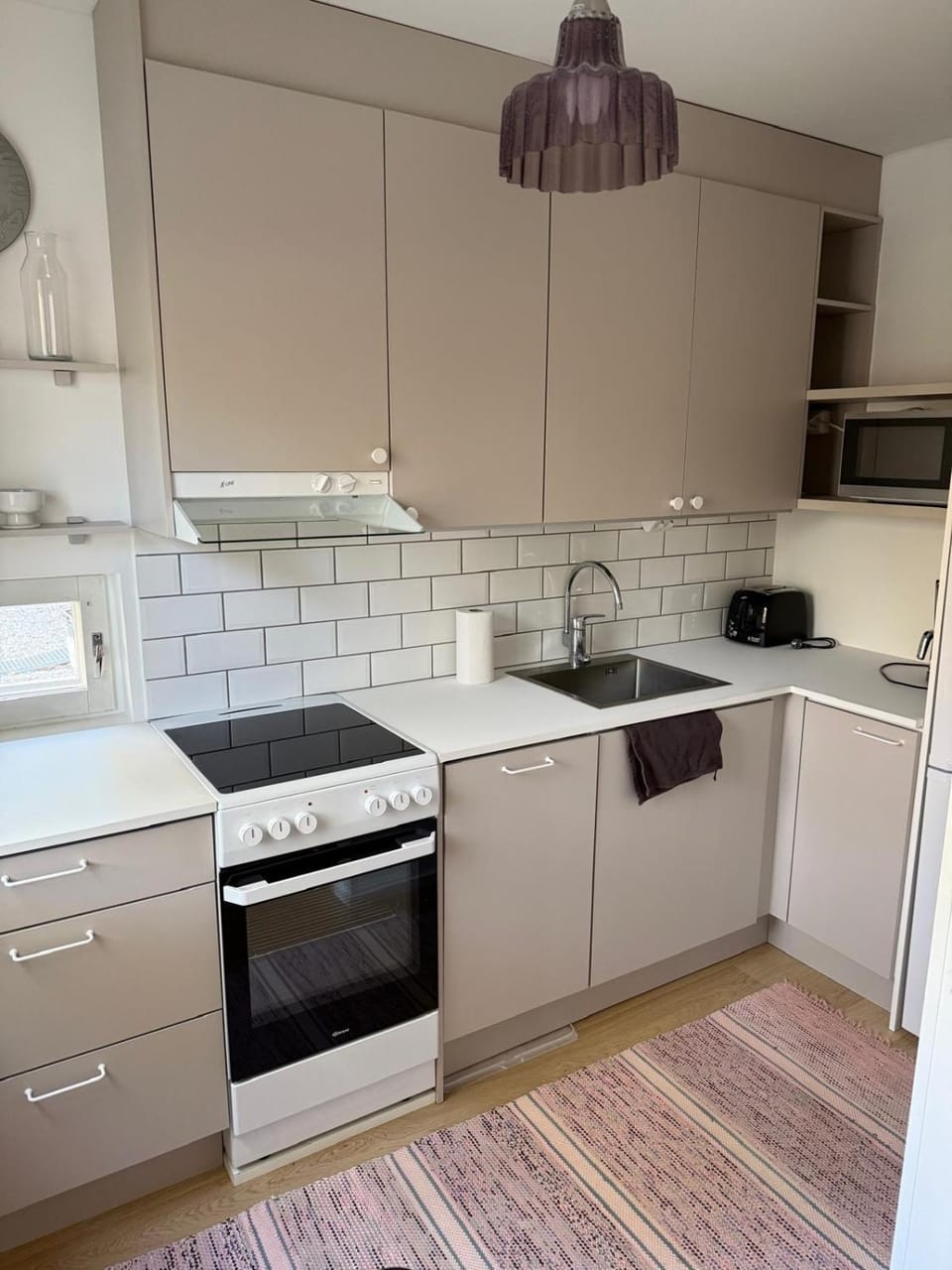 Kitchen or kitchenette, dishwasher, oven, stove, toaster