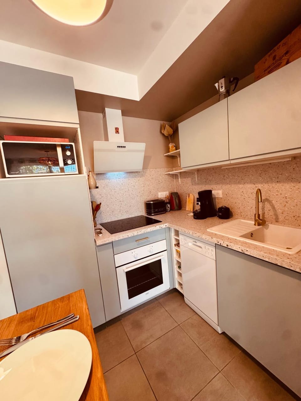 Kitchen or kitchenette, dishwasher, oven, stove