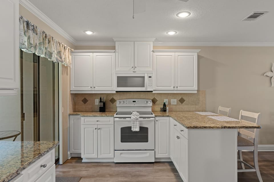 Kitchen or kitchenette, Seating area, furniture, microwave, oven