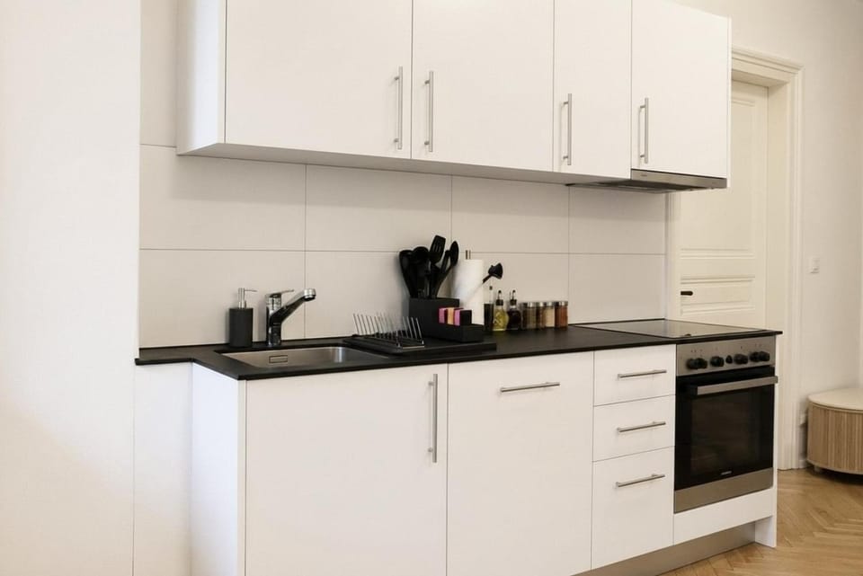 Kitchen or kitchenette, dishwasher, oven, stove