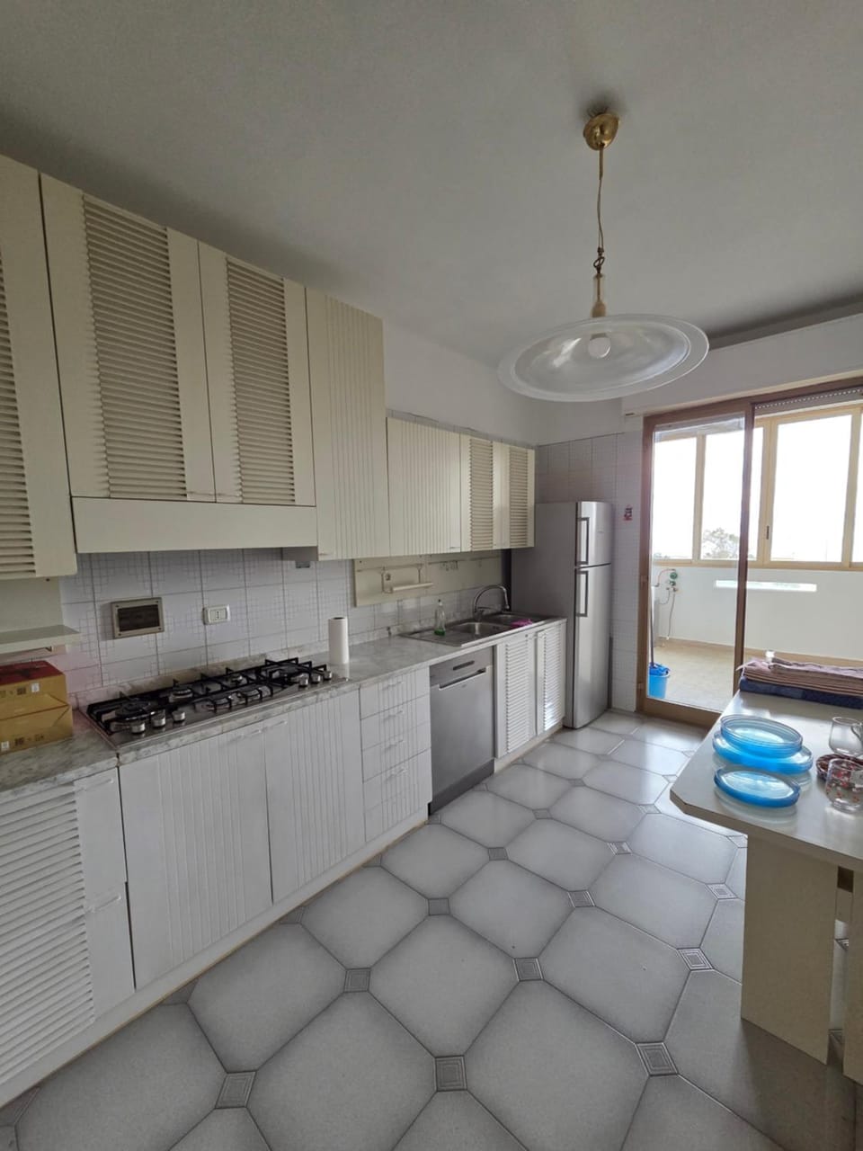 Kitchen or kitchenette, dishwasher, oven, stove