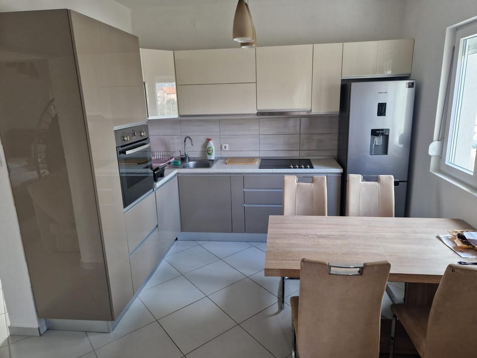 Kitchen or kitchenette, dishwasher, oven, stove