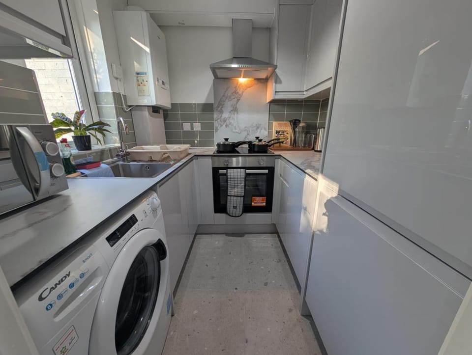 microwave, oven, stove, washing machine, kitchen
