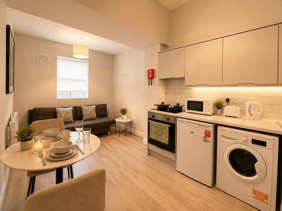 Kitchen or kitchenette, Living room, Dining area, oven, stove, toaster, washing machine