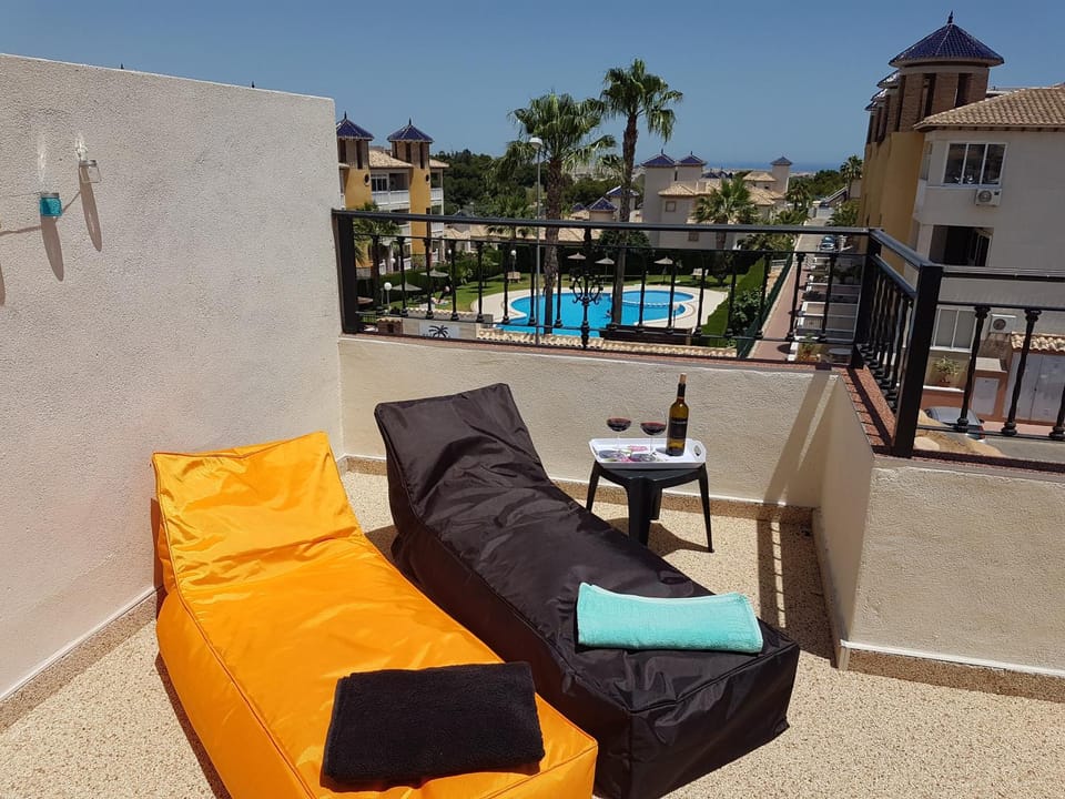 Property building, Balcony/Terrace, Seating area, Garden view, Pool view