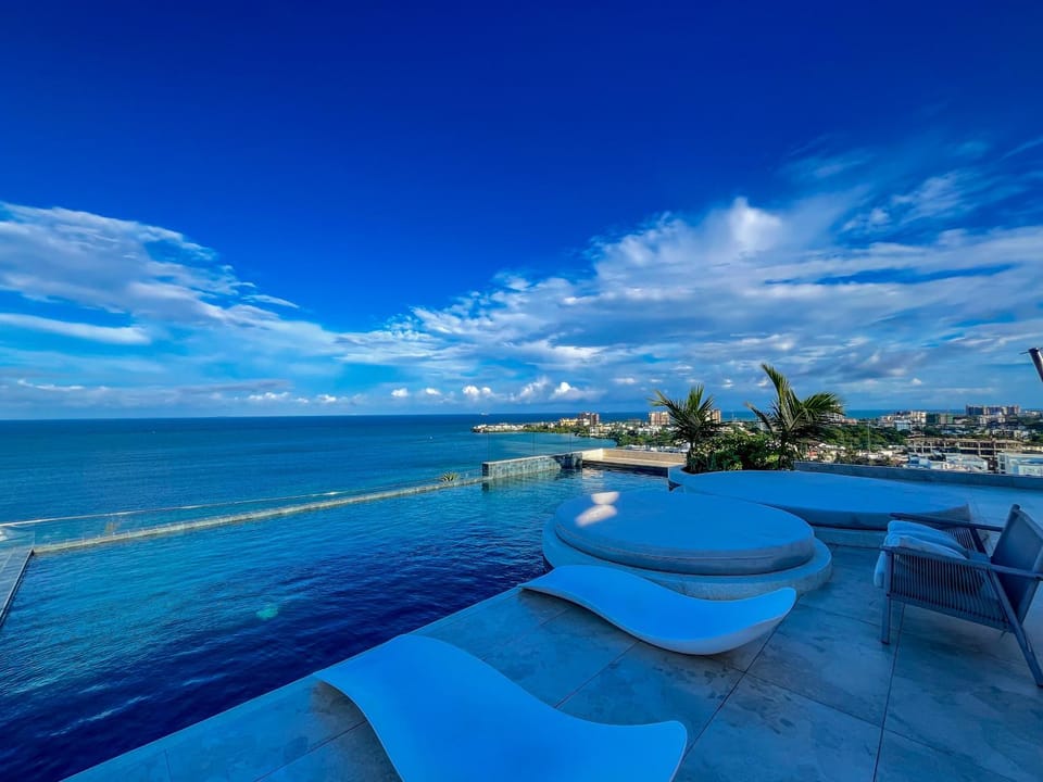 Property building, Day, Natural landscape, Living room, Seating area, Beach, Sea view, Swimming pool, sunbed