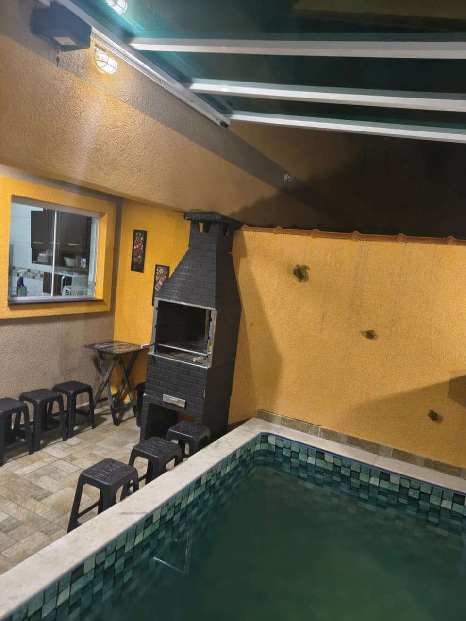 Casa de condomínio com piscina aquecida , teto panorâmico & churrasqueira House in Itanhaém