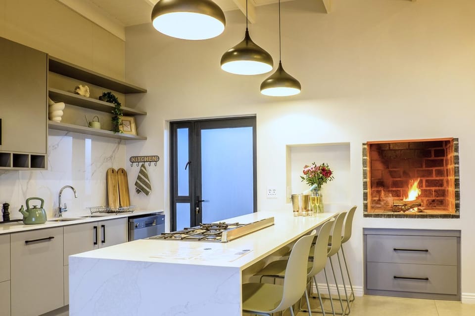 Kitchen or kitchenette, dishwasher, oven, stove
