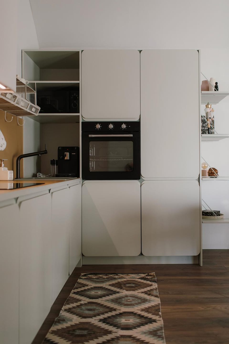 Kitchen or kitchenette, dishwasher, microwave, oven, stove